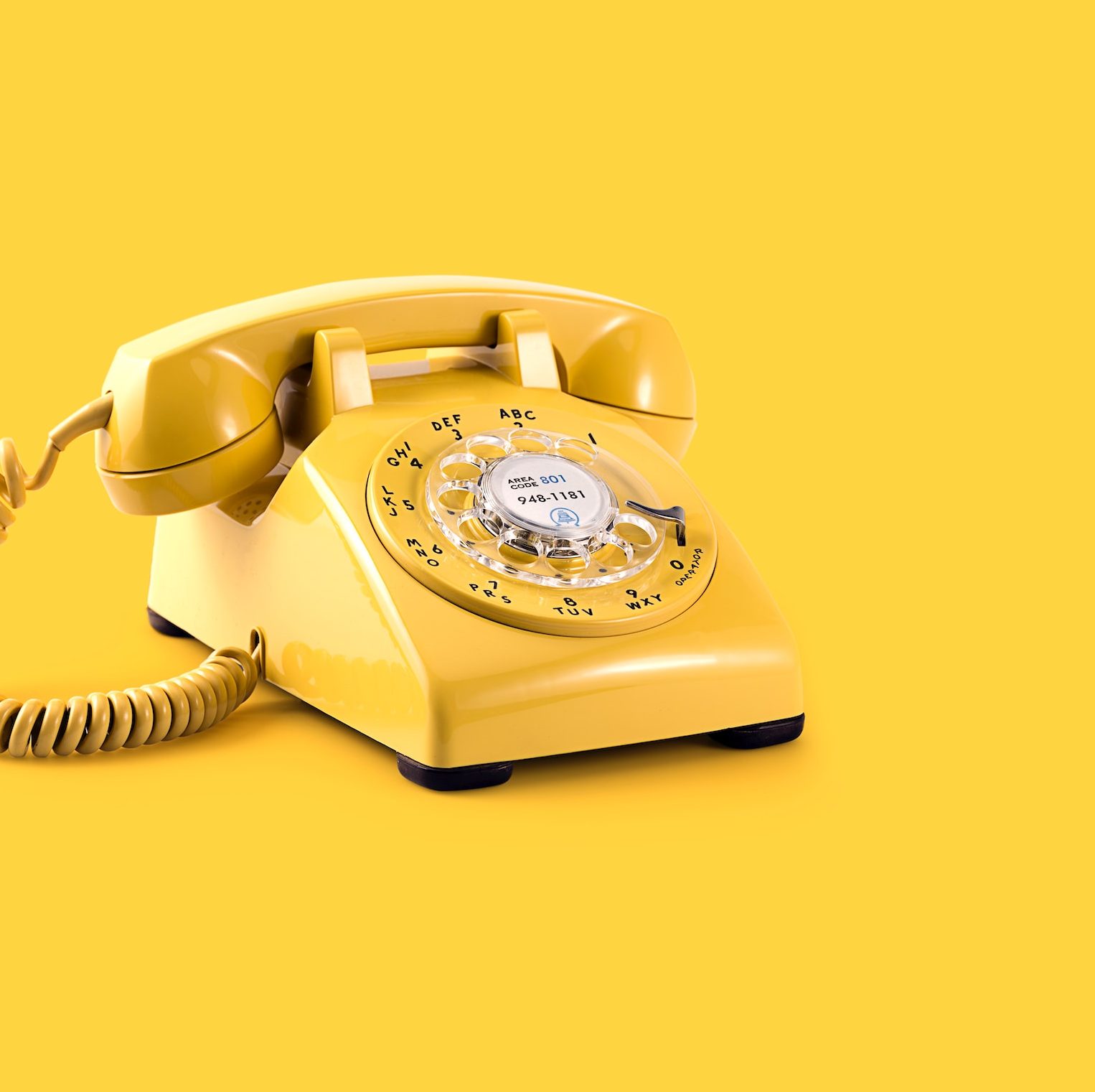 yellow rotary telephone